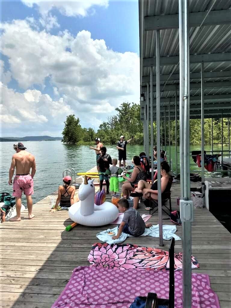 Guests enjoying a lakeside boat dock