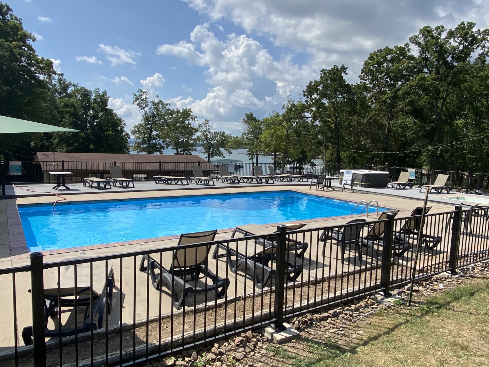 Resort pool and hot tub with lounge seating