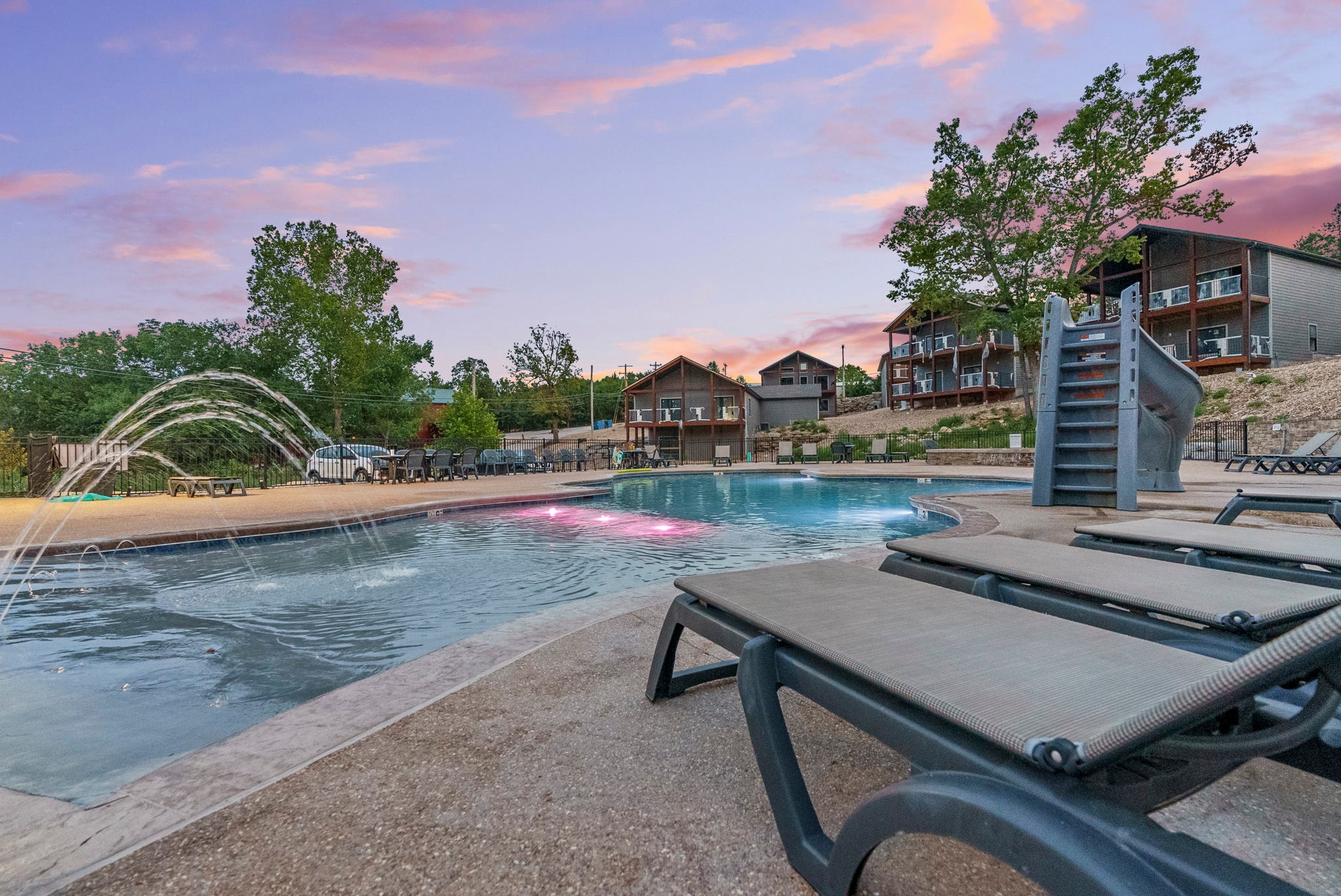 Saltwater pool with waterslide and resort villas