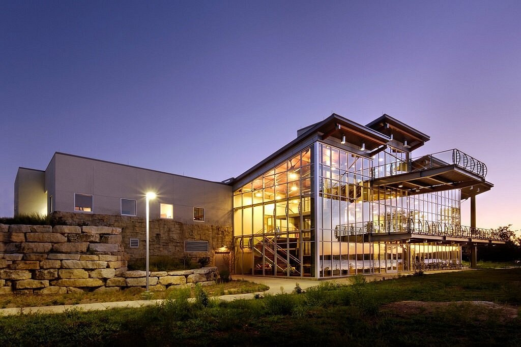 Dewey Short Visitor Center modern glass building lit at dusk
