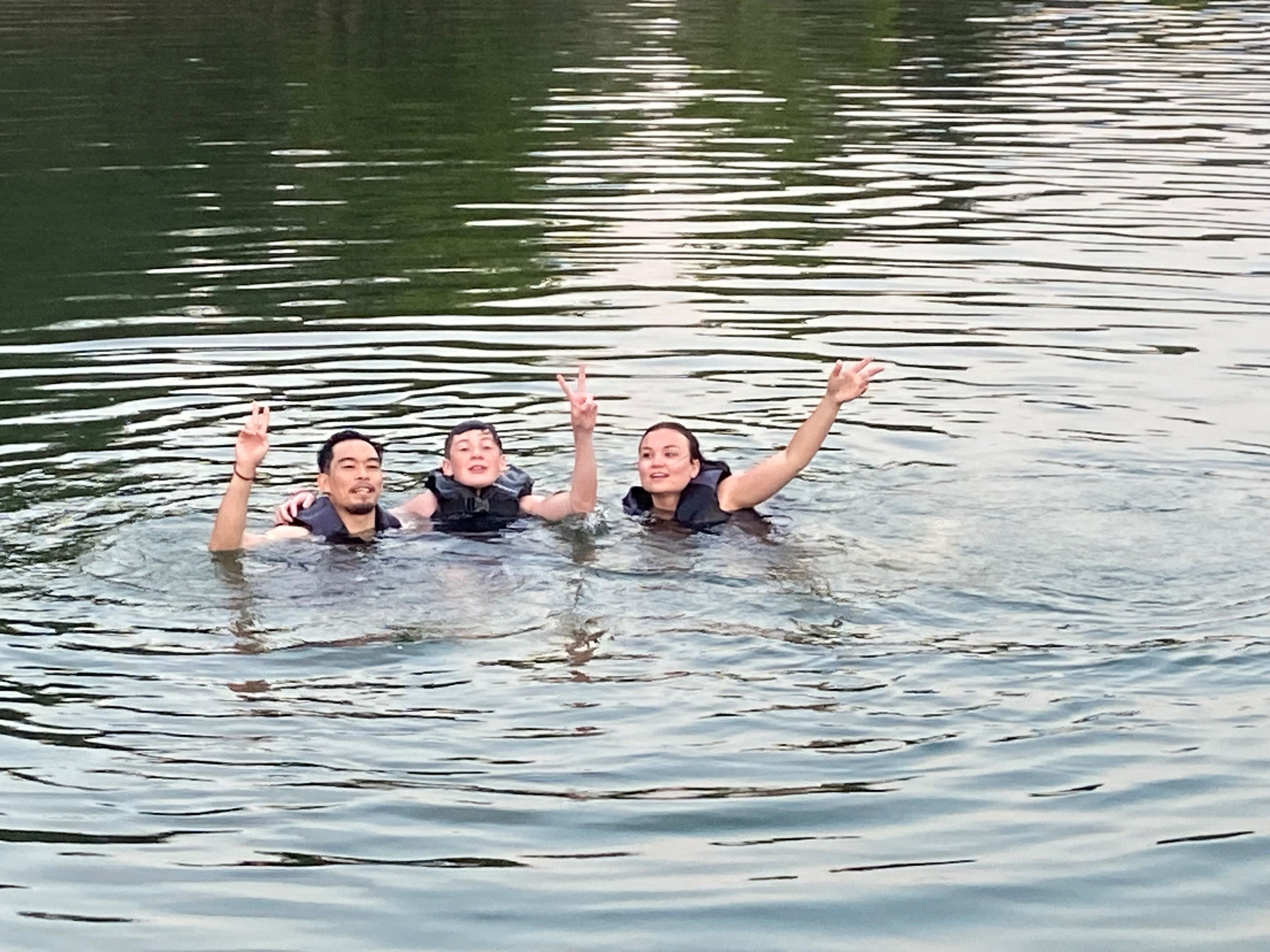 Family swimming together in Table Rock Lake